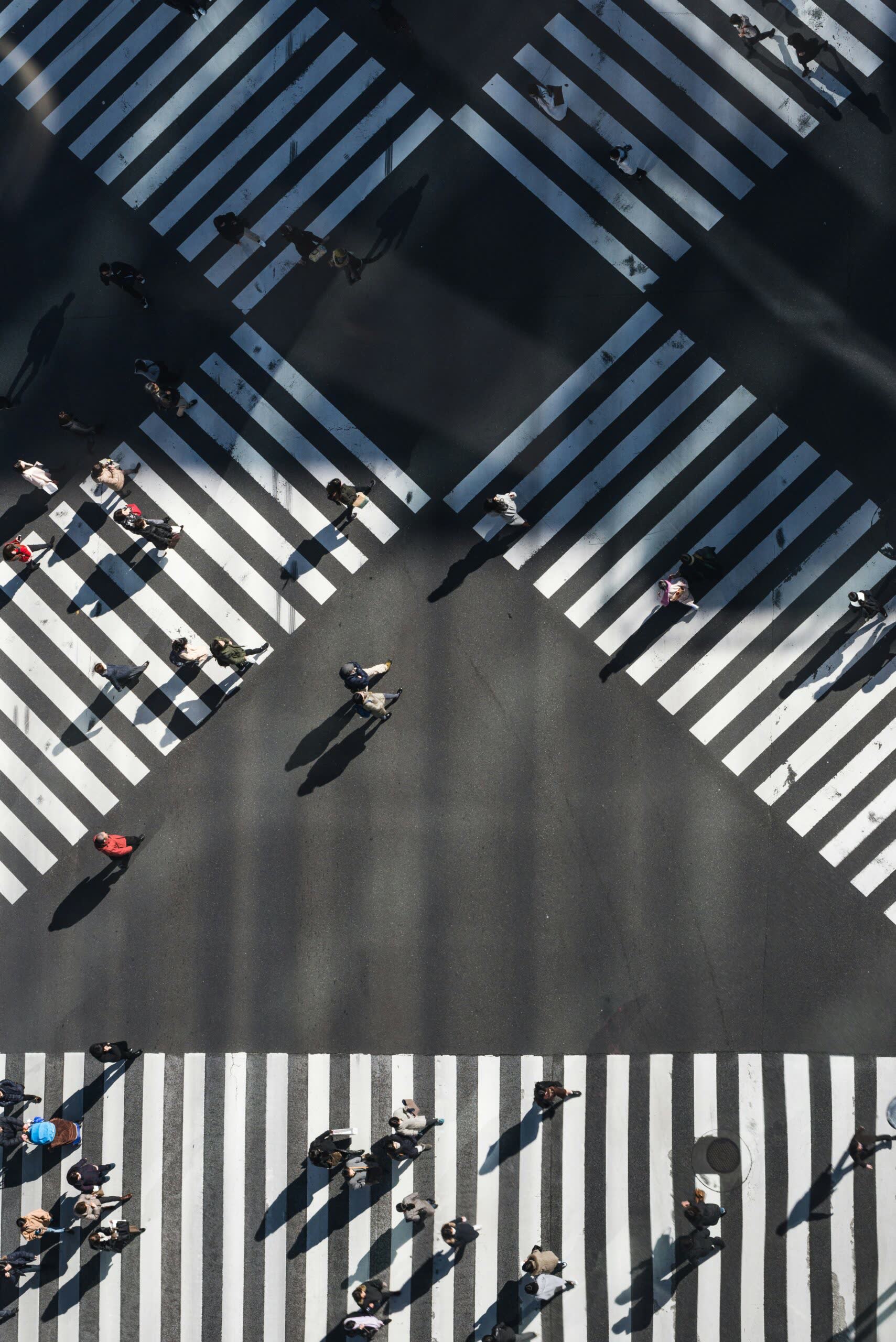 Figures crossing an open plaza